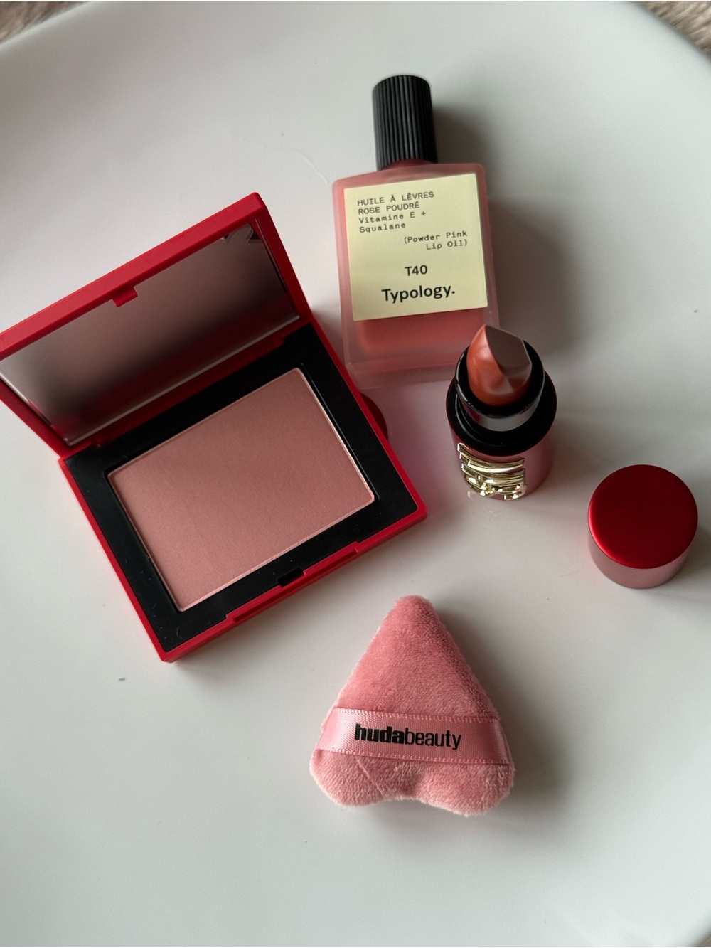 NARS Blush & Lipstick + Typology Lip Oil + Huda Puff